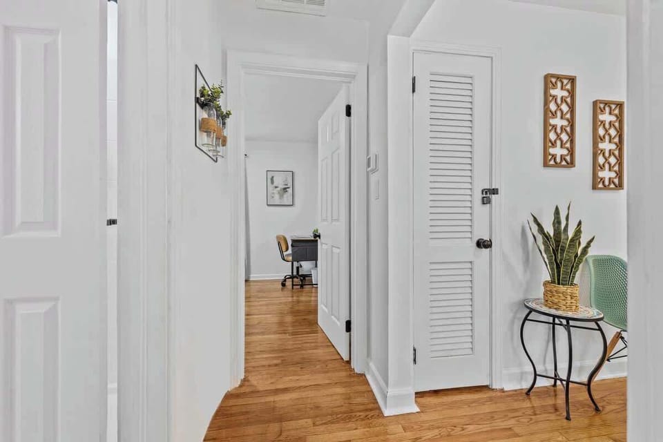 Bright hallway w/ wood floors & clean, modern design