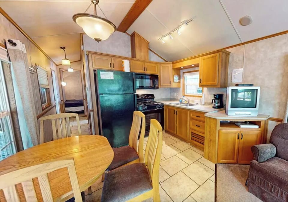 Kitchen w/ microwave, stovetop, and fridge/freezer. Use of the oven not allowed.