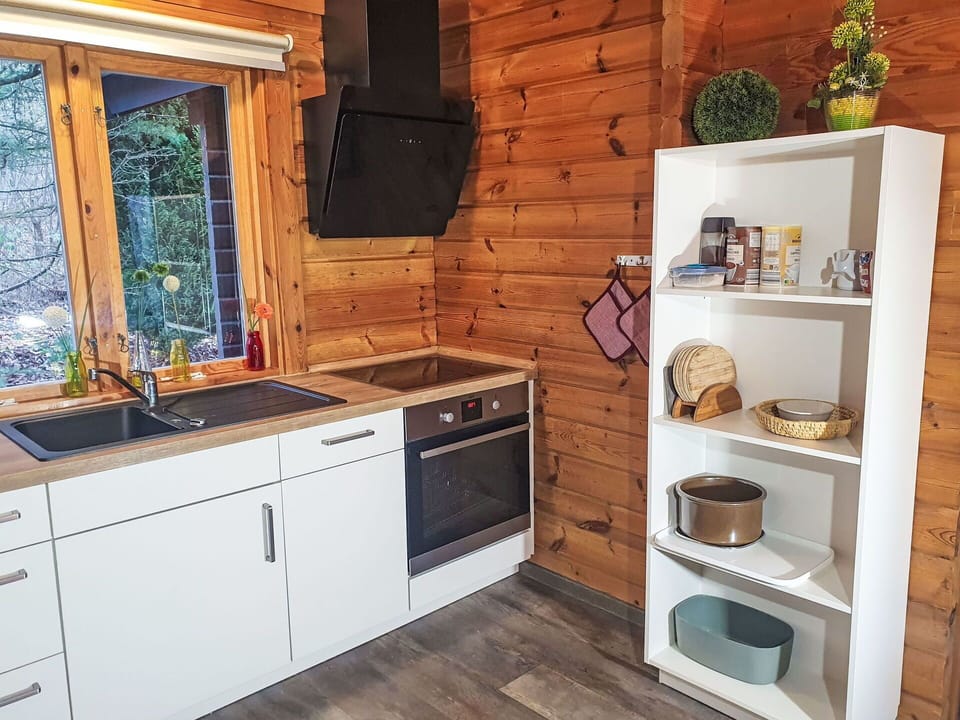 Wood, Flooring, Kitchen, Floor, Interior Design, Wood Stain, Countertop, Kitchen Appliance, Room, Major Appliance