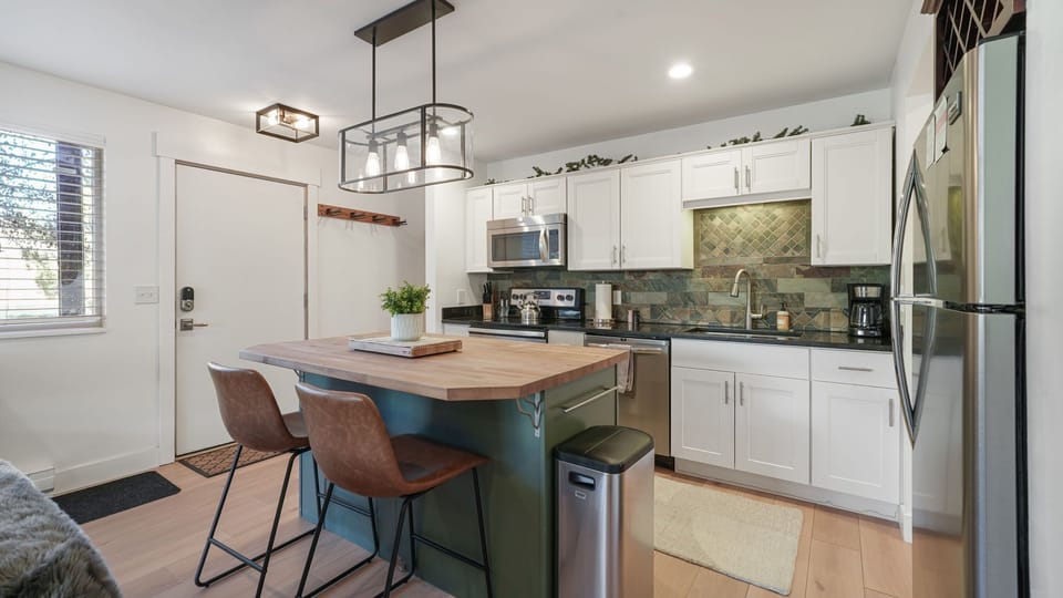 Beautiful kitchen flows into dining. Everything you need to make this your home away from home.