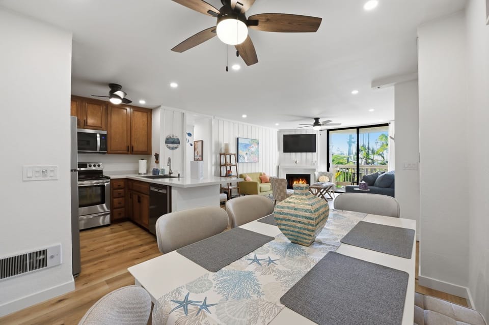 Enjoy meals together at the dining table, which seats guests with four chairs and a bench.