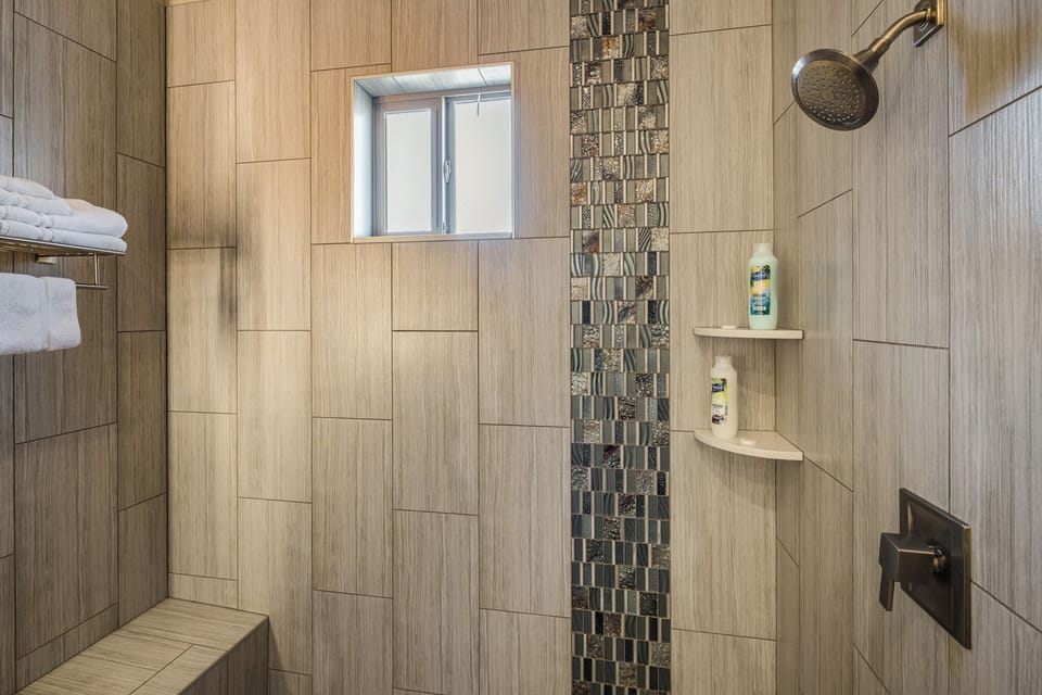 Convenient full bathroom with a walk-in shower