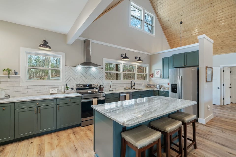 Your spacious kitchen features granite countertops, modern appliances, and a stunning island where you can gather for meals and conversation.