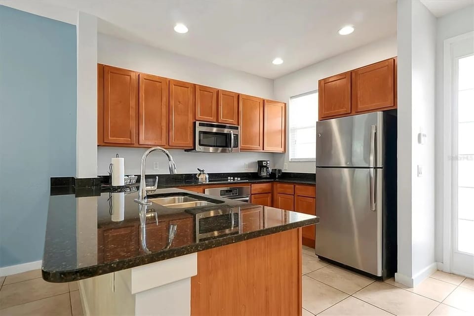 Stainless steel appliances with beautiful countertops