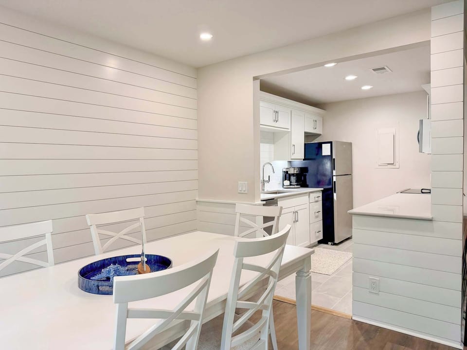Gather around this charming dining table where your family meals become treasured memories, surrounded by coastal charm and natural light.