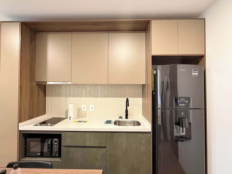 Fully equipped open kitchen with modern appliances and everything you need to prepare your meals.
