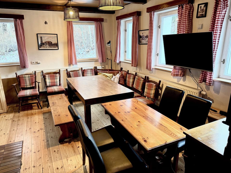 Living room , we can provide for you with extra table and chairs for 16 persons