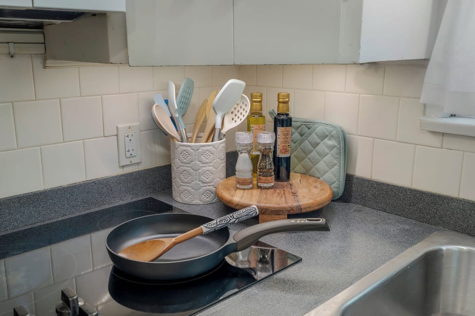 Fully stocked with the essentials — pots, pans, toaster