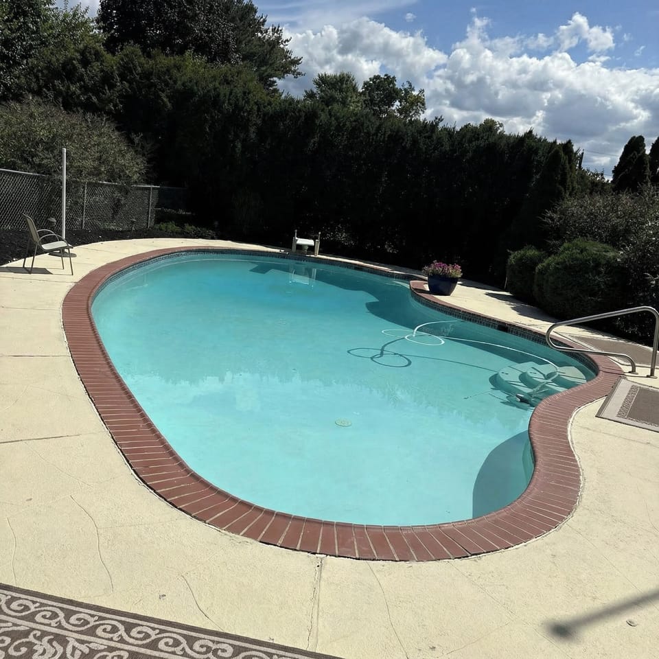 Beautiful inground pool with diving board