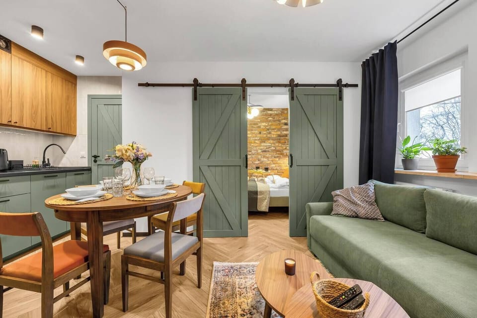 Living Room with Sofa Bed, Smart TV and Dining Table | Book Now with RENTUJEMY
