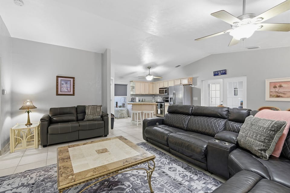 Relax in this inviting beach stay featuring a spacious open living area, plush seating, and a fully equipped kitchen—perfect for unwinding after a day by the coast. Bright, airy, and designed for comfort.