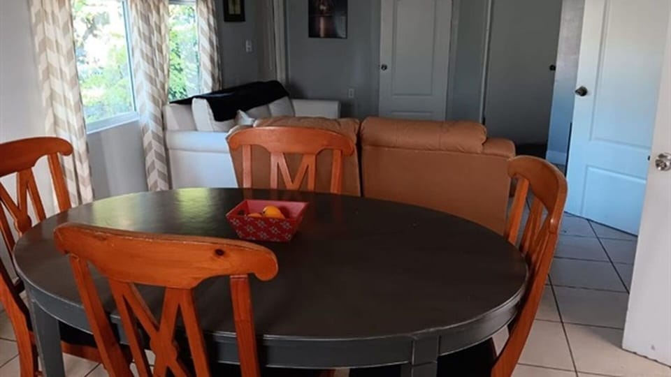 Dining area with living room seating and natural light