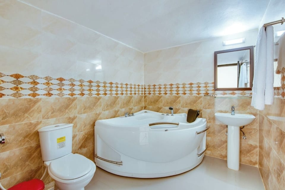 Bathtub, free toiletries, slippers, towels