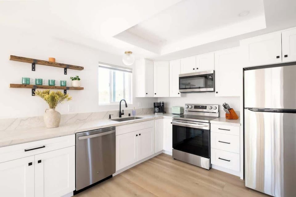 Cook up breakfast, lunch and dinner using the stainless steel appliances 