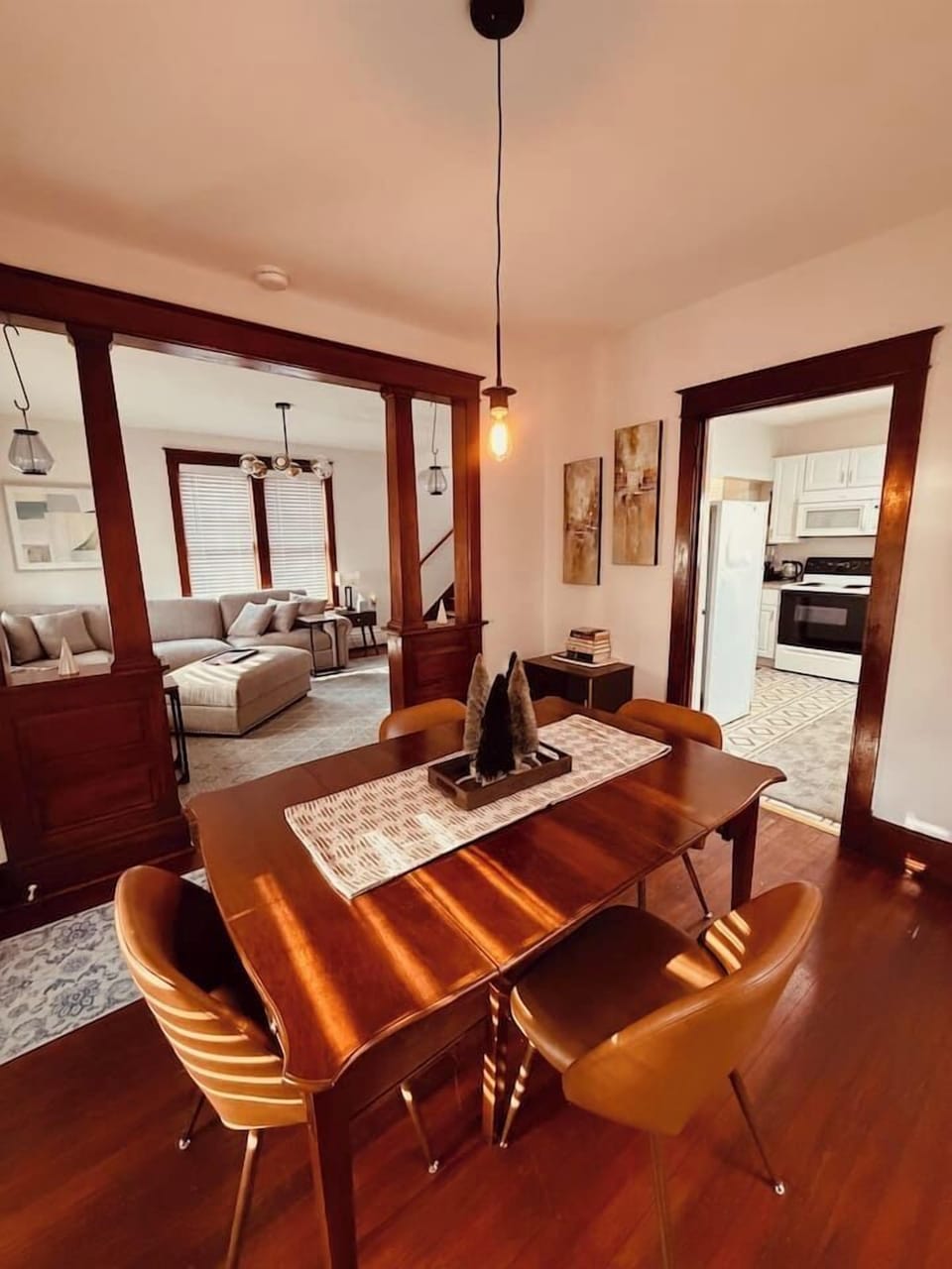 Dining area with seating for meals or game nights, open to the living room and kitchen