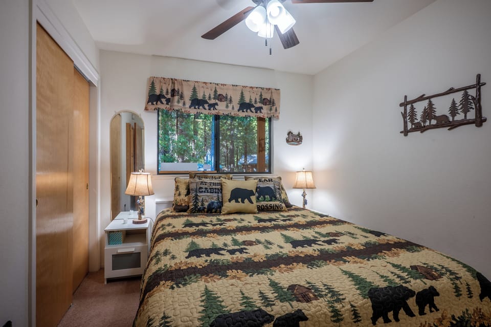Comfortable queen bedroom with natural light