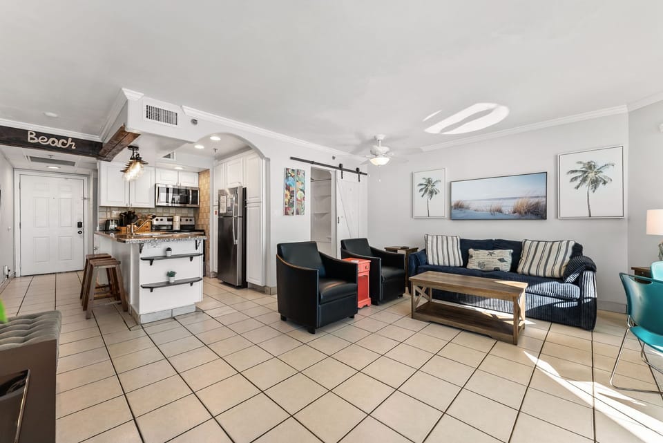 Open living area with modern kitchen and comfortable seating