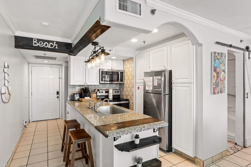 Modern kitchen with granite countertops and stainless steel appliances