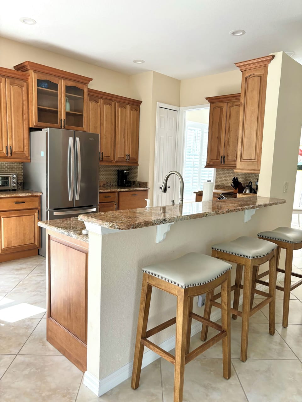 Well-appointed kitchen with stainless appliances, granite countertops