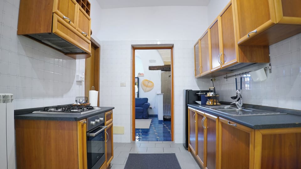 Townhome, Balcony, City View | Private kitchen | Full-size fridge, oven, stovetop, espresso maker