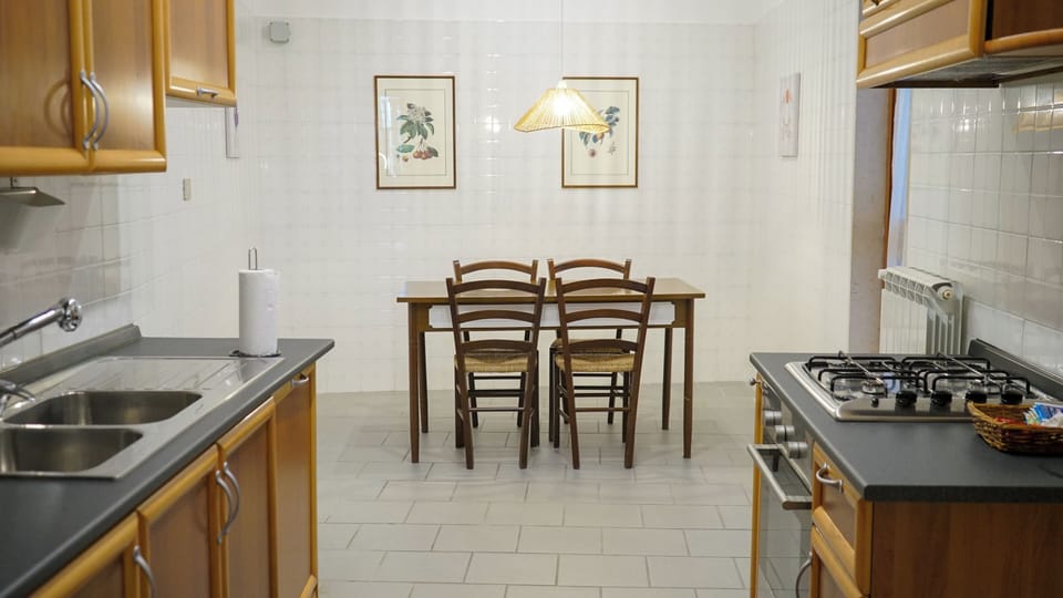 Townhome, Balcony, City View | Private kitchen | Full-size fridge, oven, stovetop, espresso maker