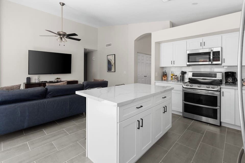 The living room is spacious, comfortable and a great place for everyone to gather.