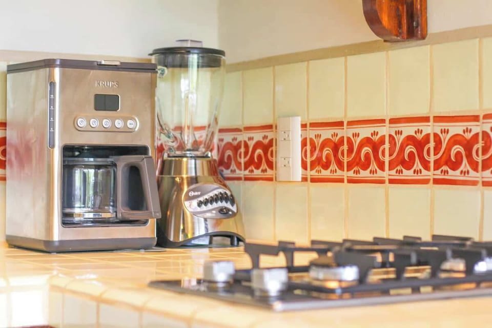 Coffee Maker, blender and 2 burner gas stove top.