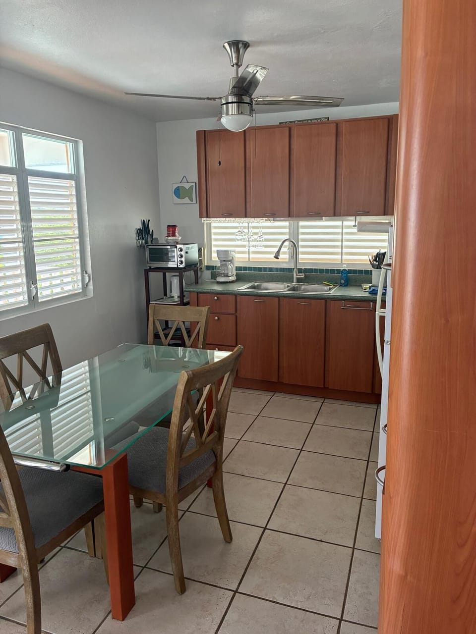 Side angle dinning area and part of kitchen with coffe maker