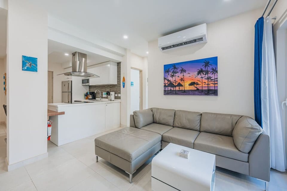Spacious living room with an adjoining dining area, perfect for relaxing and entertaining.