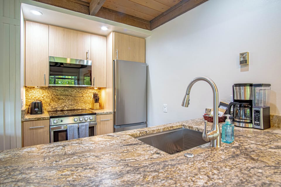 Brand new kitchen with granite countertops and stainless appliances