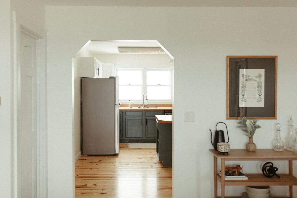Easy flow from living spaces into the kitchen, designed for groups to move comfortably throughout the home.