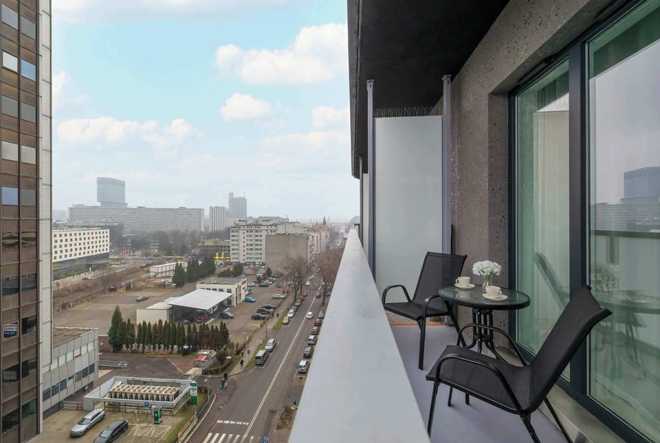 The balcony provides a perfect spot for enjoying the fresh air. 