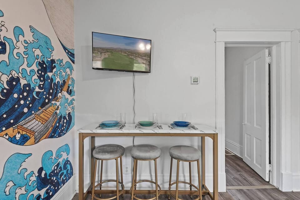 Enjoy a casual meal or lively conversation at this stylish bar, complete with comfortable seating and a view of the TV for entertainment.