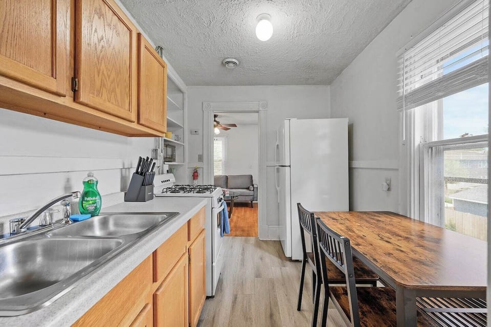 Kitchen w/ a small table for quick bites.