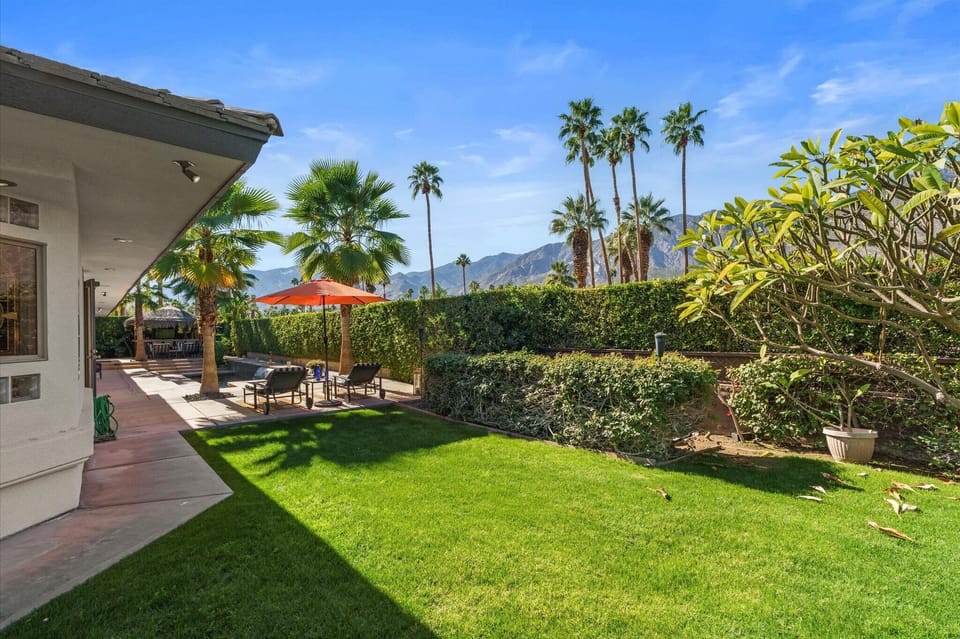 Spacious backyard lawn with mountain views and outdoor seating