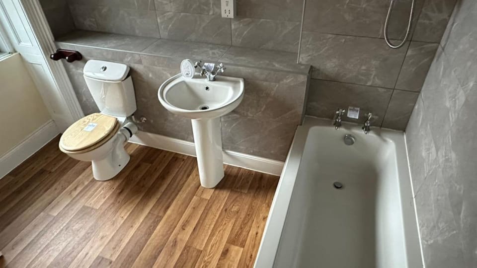 Combined shower/tub, hair dryer, towels, soap