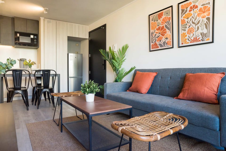 Charming living space with vibrant decor, perfect for unwinding or dining in style.