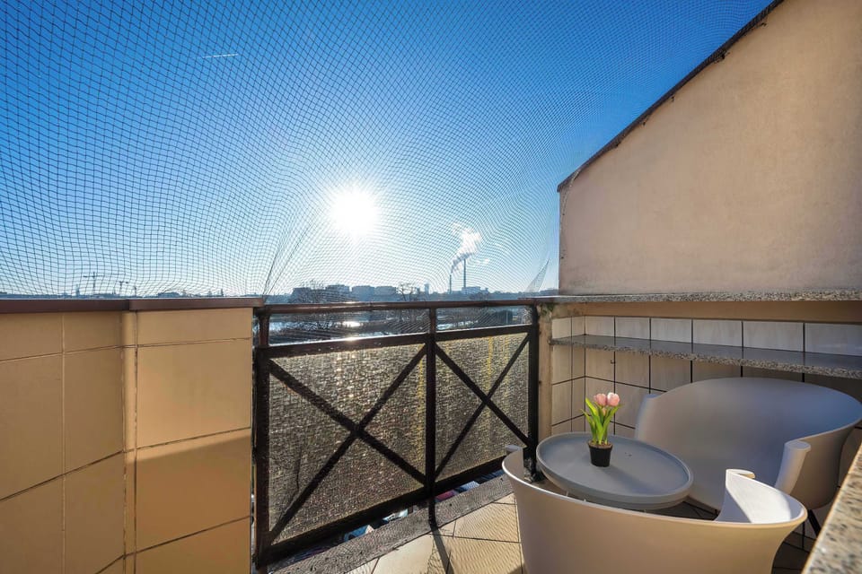 Balcony with outdoor seating and city views