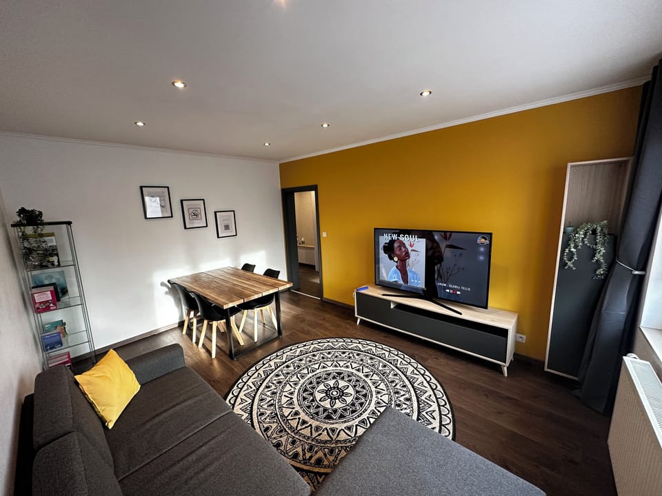 Comfort Apartment, Garden View | Living area | Flat-screen TV