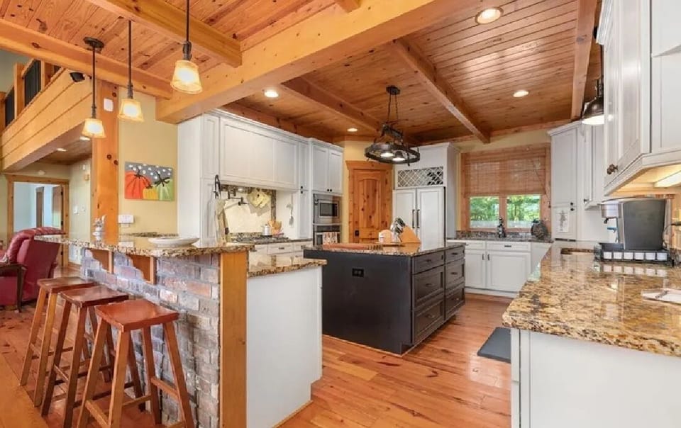 Kitchen w/ extra seating at the bar! - Hosted by LakeGastonVacationHomes