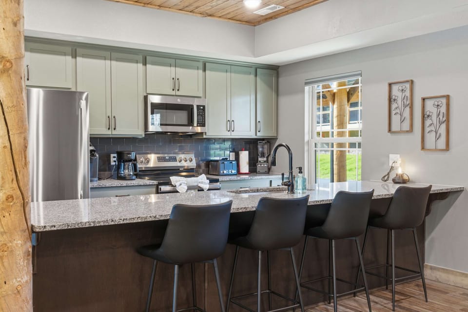 The open kitchen offers ample space & all the comforts of home​