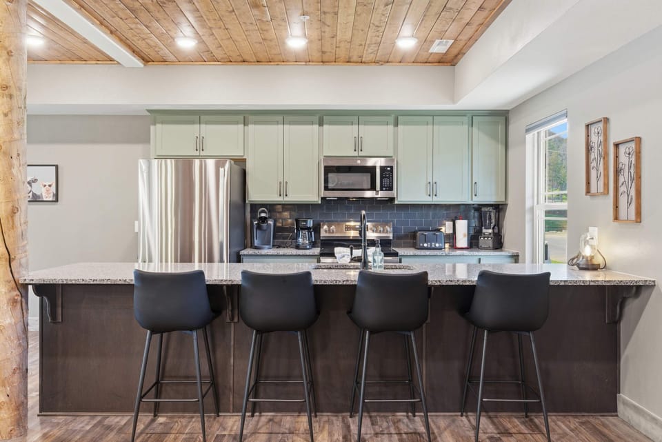 The open kitchen offers ample space & all the comforts of home​