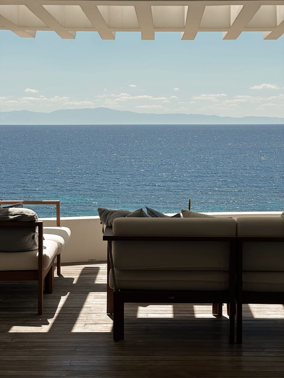 Terrace seating area overlooking the sea, designed for outdoor living
