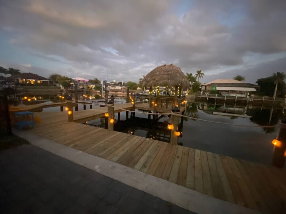 Twilight serenity—lanterns, ambient lighting, and the underwater fish light turn on automatically each evening.
