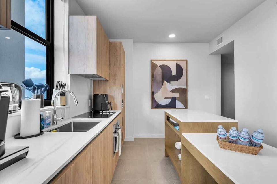 Ready for your arrival. Step into a spotless modern kitchen, complete with a versatile island for dining and complimentary refreshments to start your stay