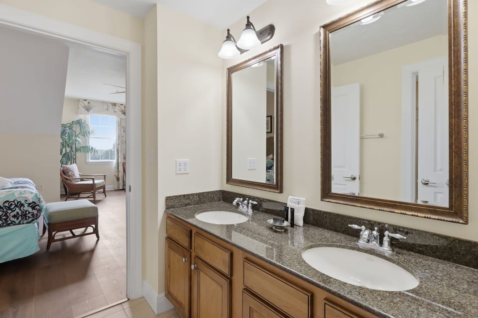 This full bathroom offers a spacious vanity, a separate tub and shower, and plenty of room to get ready for the day.