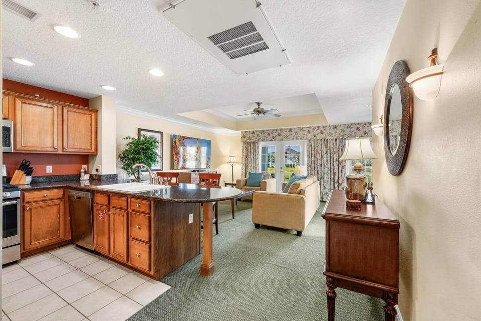 Fully equipped kitchen with modern appliances, ample counter space, and everything needed for home-cooked meals.