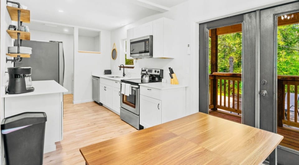 Bright kitchen with stainless appliances and space to cook together