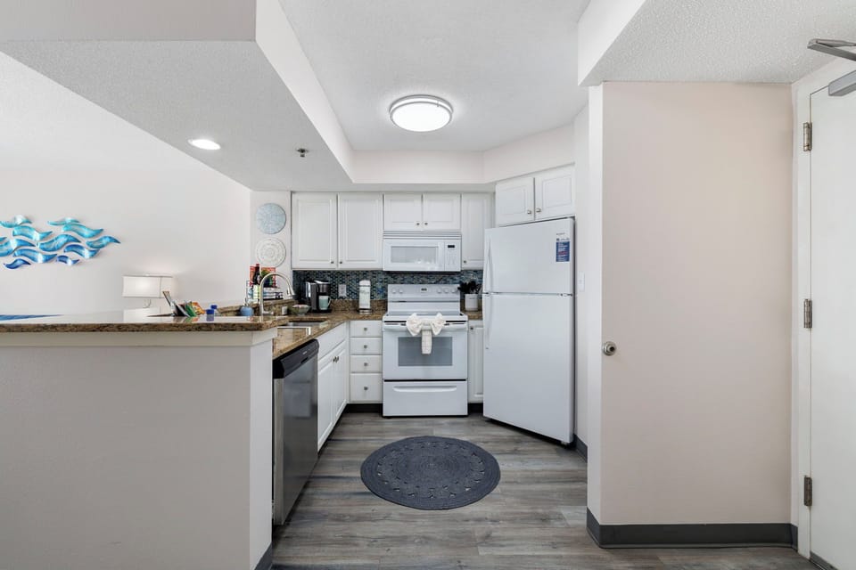 Save money on vacation and enjoy this fully stocked kitchen to cook like home.