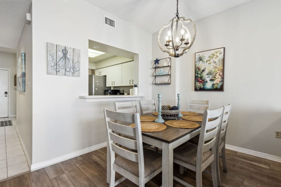 Dine with a view! Six-person coastal dining table looks past the living room straight out to the ocean.